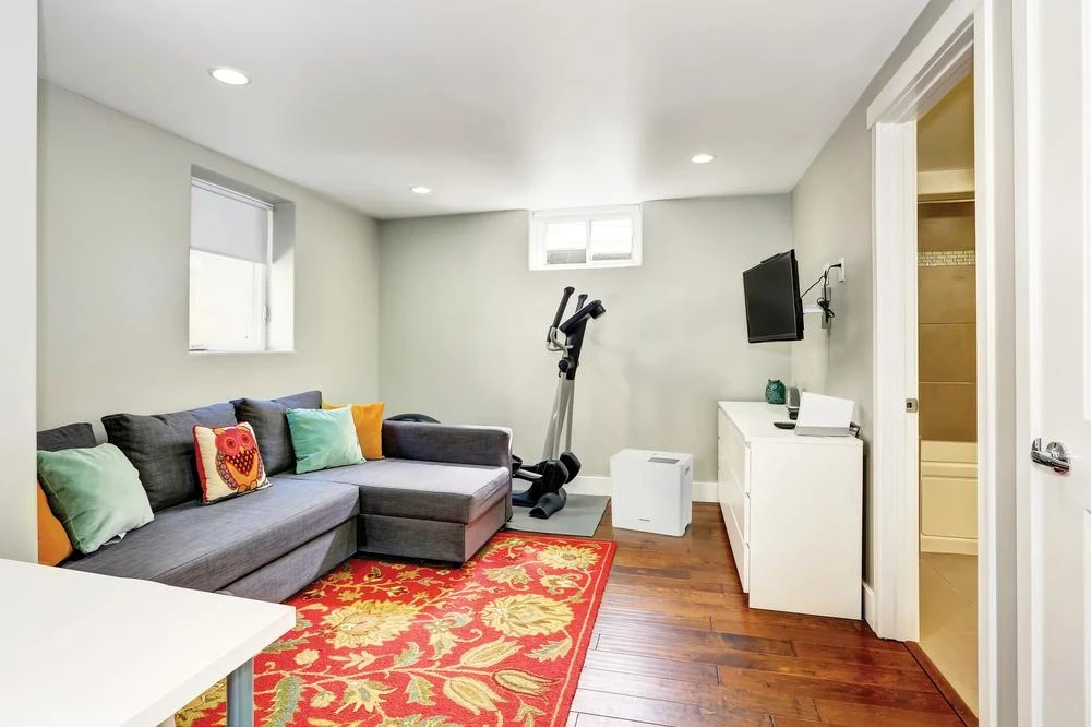 Frigidaire FHDD2233Y1 shown in a furnished room in the manufacturer’s lifestyle image.