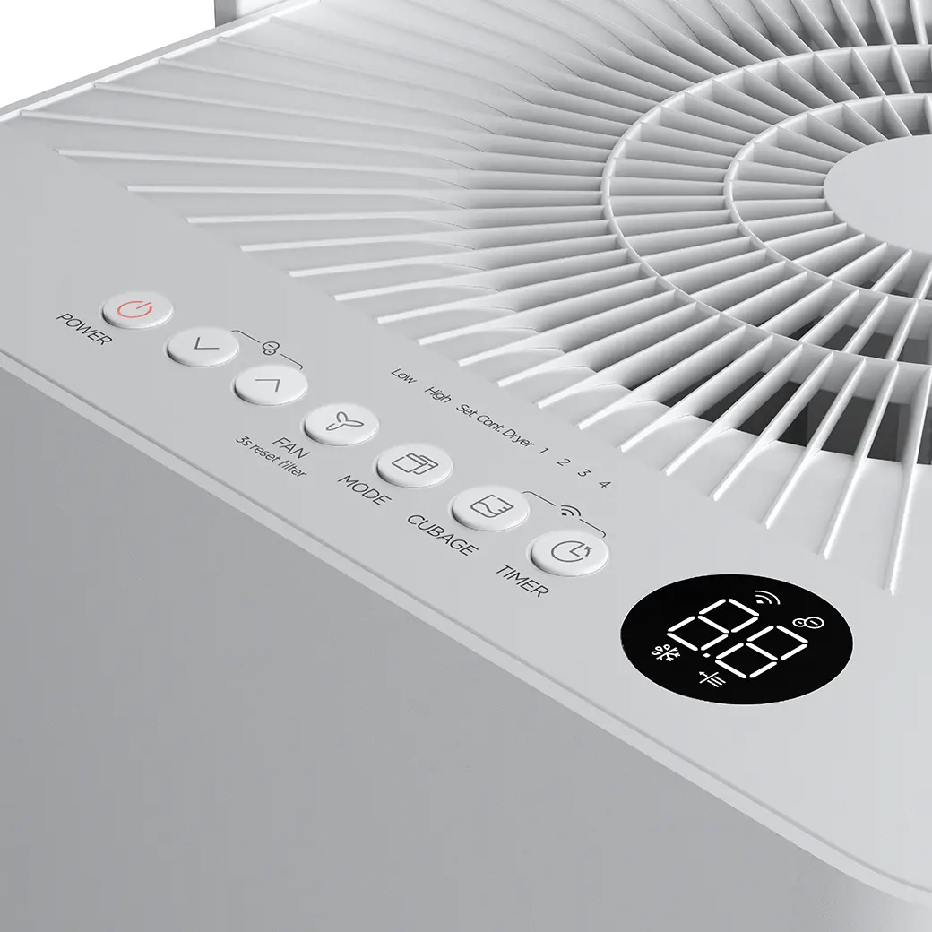 Close view of the Midea MAD50PS1QWT-A control buttons and top air outlet.